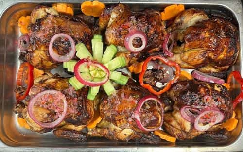 Pollo a la Brasa recipe served on a plate, by El Sabor Tropical Restaurant