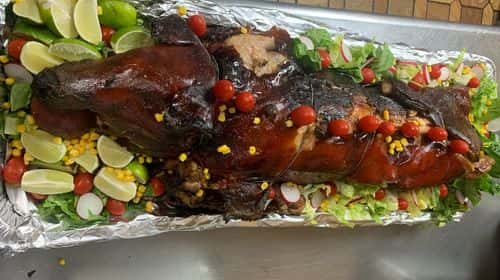Puerco Asado recipe served on a plate, by El Sabor Tropical Restaurant
