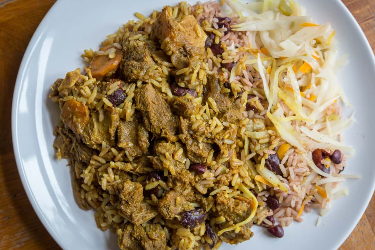 Curry Goat recipe served on a plate, by Dunn's River Jamaican Restaurant