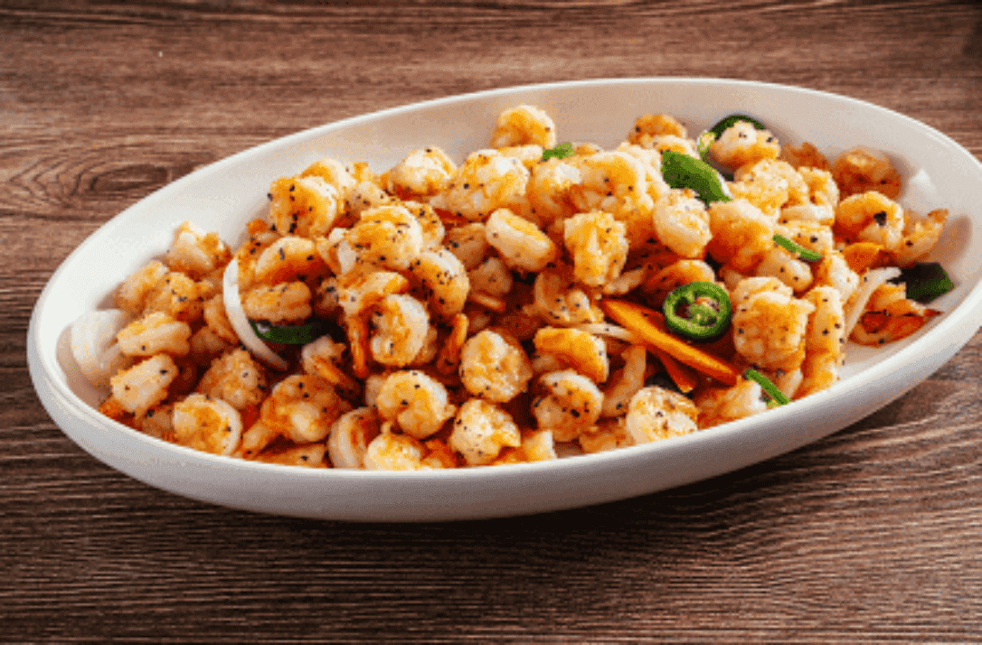 Sesame Shrimp recipe served on a plate, by Umi Sushi & Seafood Buffet