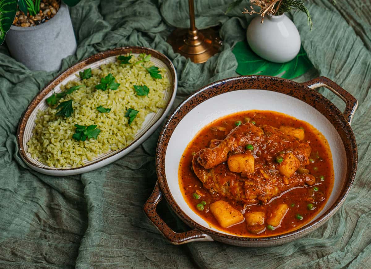 Fricase de Pollo recipe served on a plate, by El Puro Cuban Restaurant