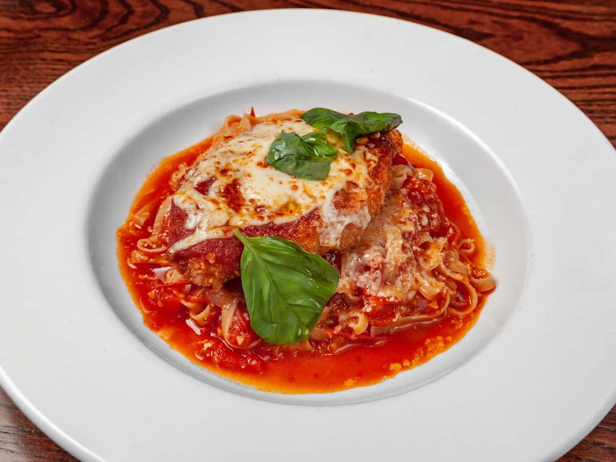 Eggplant Parmesan recipe served on a plate, by Napoli Italian Eatery