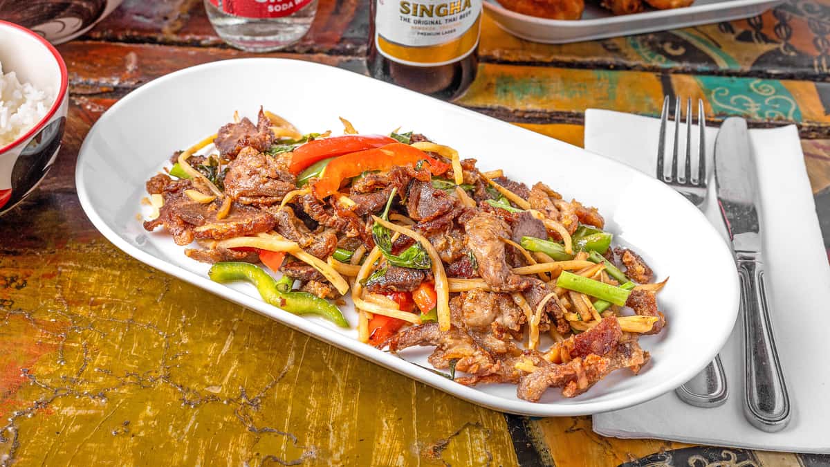Duck Basil recipe served on a plate, by Lung Yai Thai Tapas
