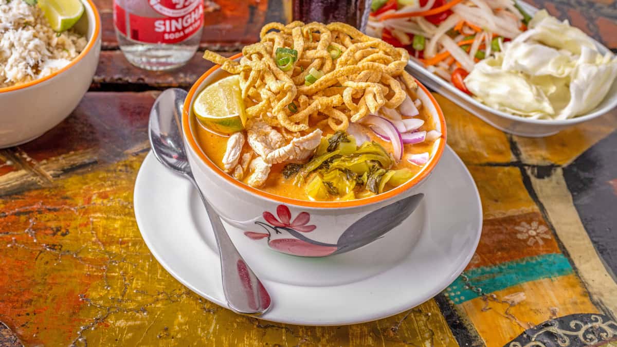 Khao Soi Chicken recipe served on a plate, by Lung Yai Thai Tapas
