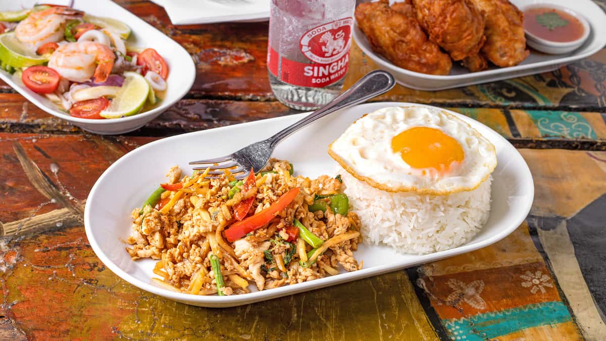 Thai Style Basil recipe served on a plate, by Lung Yai Thai Tapas