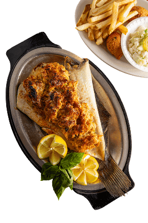Grilled Whole Fish recipe served on a plate, by Middendorf's Manchac