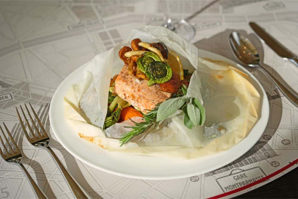 Salmon en Papillote recipe served on a plate, by Park Grill | Arkansas Museum of Fine Arts