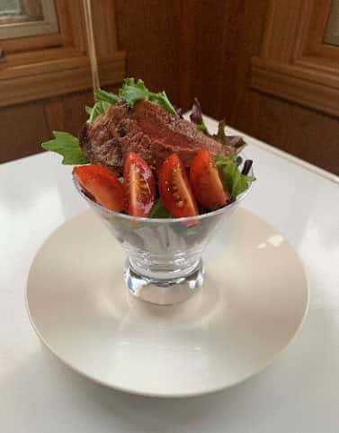 Grilled Beef Salad recipe served on a plate, by Thai Jasmine of Rockford