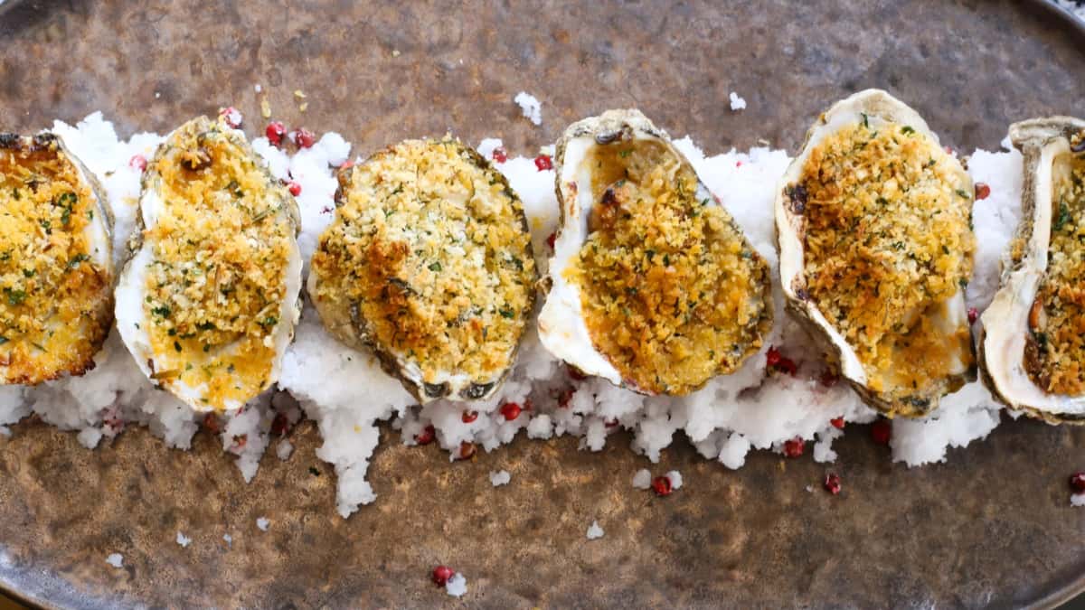 Broiled Oysters recipe served on a plate, by The Boheme Broiled Oysters recipe served on a plate, by The Boheme