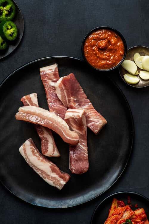 Premium Seared Pork Belly recipe served on a plate, by Baekjeong Temple City
