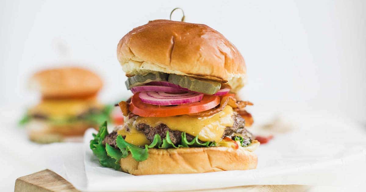 TCR Dry Aged Cheeseburger recipe served on a plate, by The Courtney Room