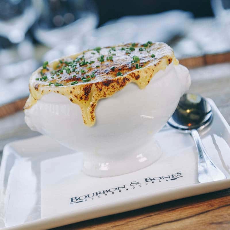 French Onion Soup recipe served on a plate, by Bourbon & Bones Chophouse | Bar