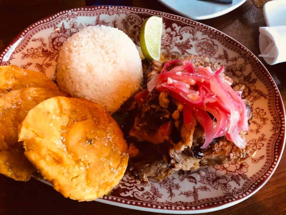 Lechon Asado recipe served on a plate, by La Bodeguita De Mima Cuban Restaurant and Rum Bar