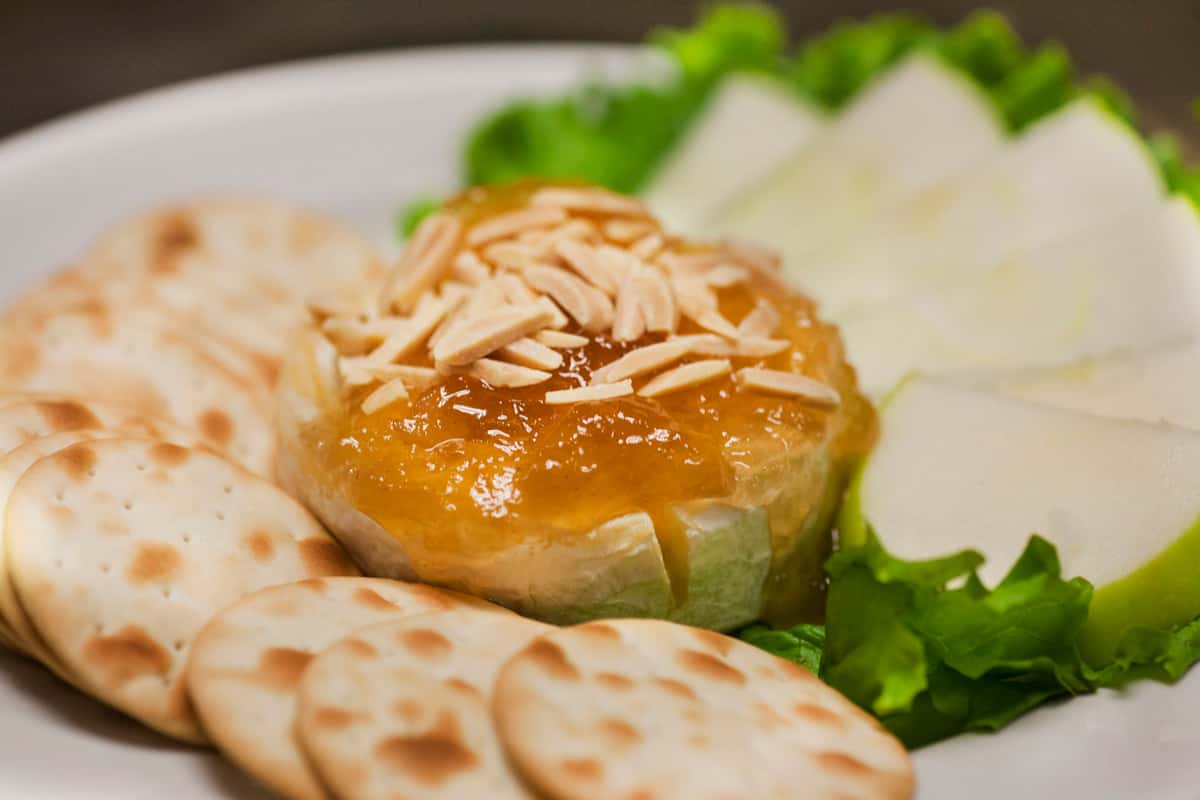 Warm Brie recipe served on a plate, by Trio's Restaurant