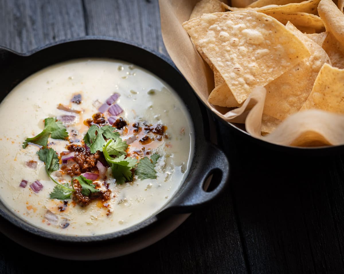 Tex-Mex Queso recipe served on a plate, by Cactus Alki Beach