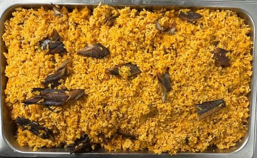 Locrio de Arenque recipe served on a plate, by El Sabor Tropical Restaurant