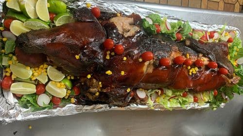 Puerco Asado recipe served on a plate, by El Sabor Tropical Restaurant