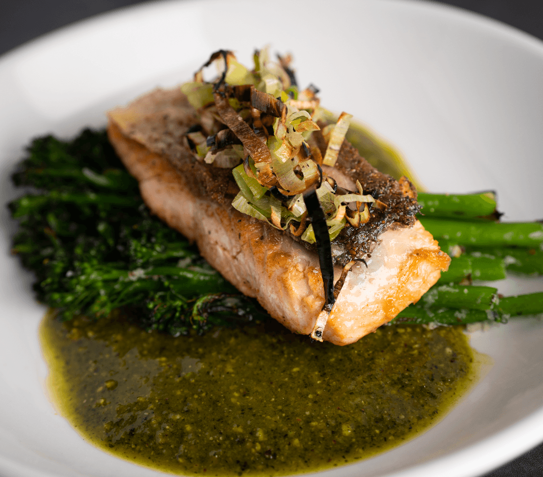 Salmon recipe served on a plate, by Bavaro's Pizza Napoletana & Pastaria