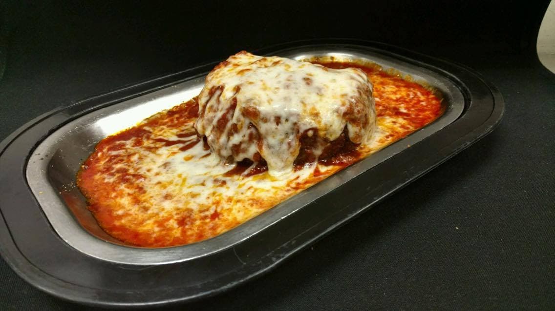 Lasagna recipe served on a plate, by Papa Frank's
