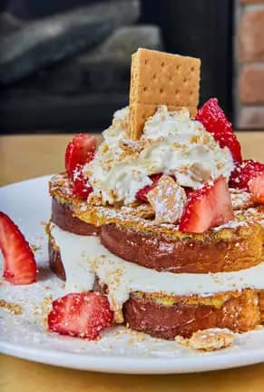 Strawberry Cheesecake French Toast recipe served on a plate, by Cosmos Restaurant