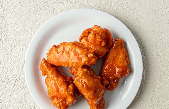 Wings 5ct Traditional recipe served on a plate, by Fazoli's Wings 5ct Traditional recipe served on a plate, by Fazoli's