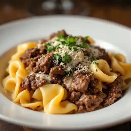 campanelle & braised beef ragu bianco recipe served on a plate, by Ask For Luigi Restaurant