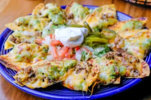Nachos recipe served on a plate, by Joe's Grill & Cantina Nachos recipe served on a plate, by Joe's Grill & Cantina