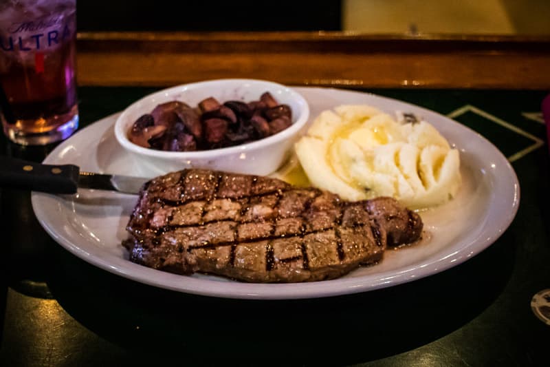 Steak recipe served on a plate, by Lucky Lou's American Grill