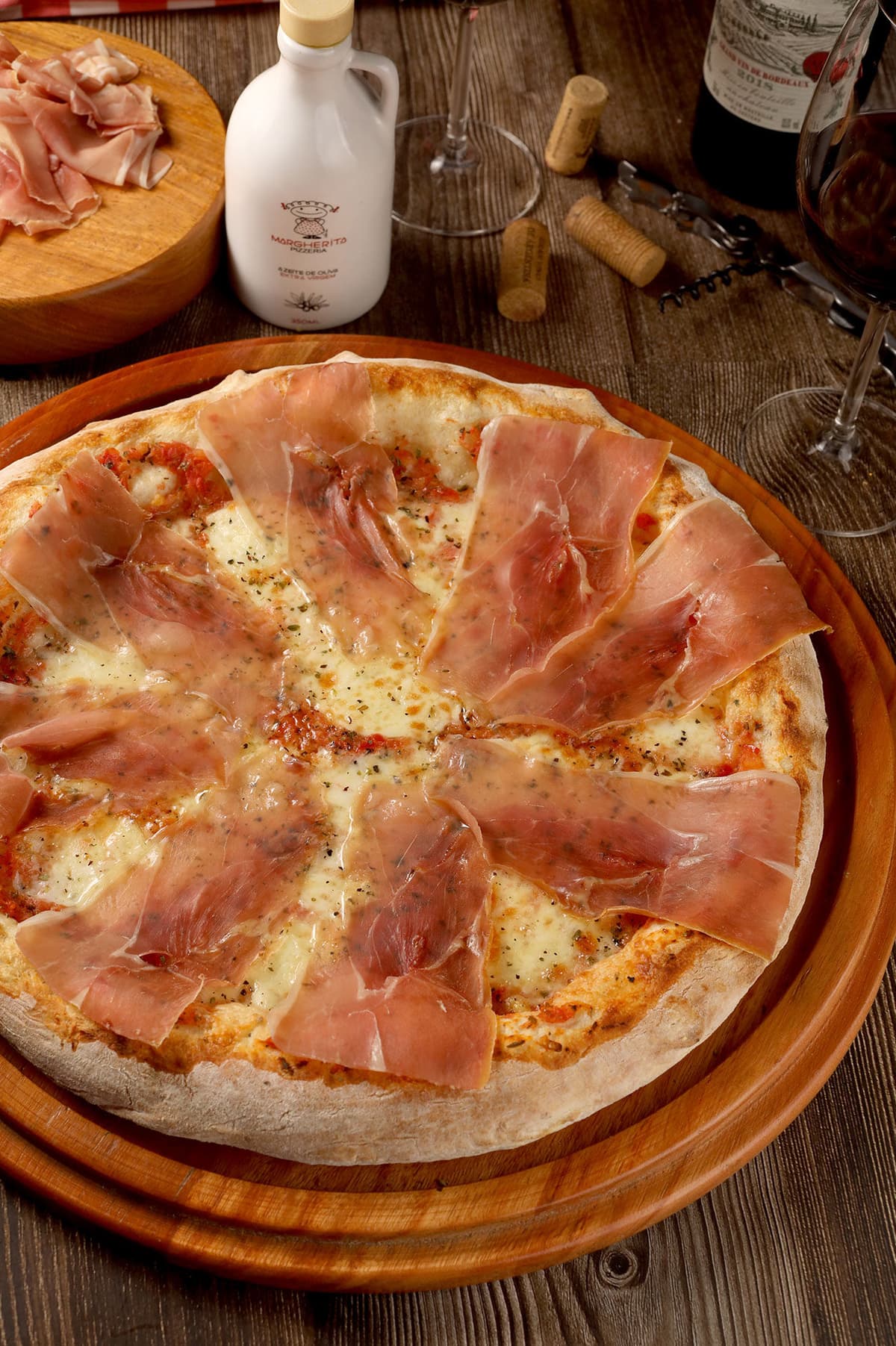 Prosciutto Crudo recipe served on a plate, by Margherita Pizzeria Prosciutto Crudo recipe served on a plate, by Margherita Pizzeria
