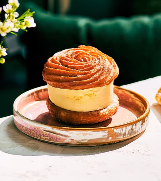 Churro Ice Cream recipe served on a plate, by Moxies Orleans Restaurant