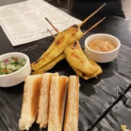 Chicken Satay recipe served on a plate, by Thai Meric Eatery & Bar