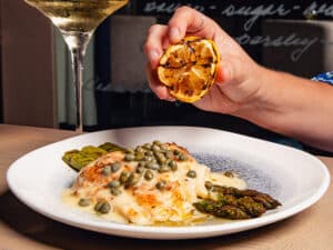 Fish & Asparagus recipe served on a plate, by The Sacred Pepper