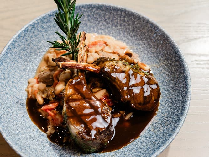 Lamb Chops recipe served on a plate, by The Sacred Pepper Lamb Chops recipe served on a plate, by The Sacred Pepper