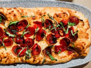 Pizzette Pepperoni recipe served on a plate, by The Sacred Pepper