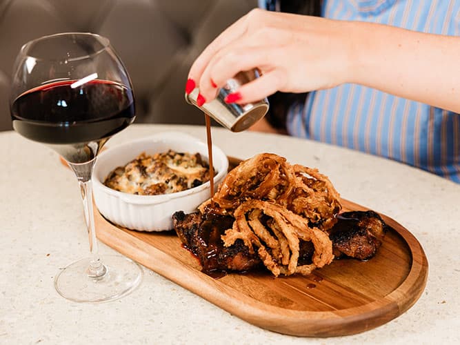 Strip Steak recipe served on a plate, by The Sacred Pepper