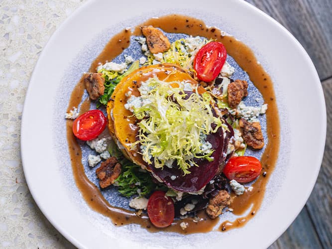 Beet Salad recipe served on a plate, by The Sacred Pepper Beet Salad recipe served on a plate, by The Sacred Pepper