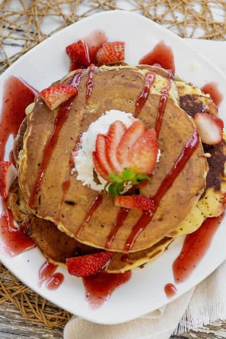 Pancakes recipe served on a plate, by The Buttered Biscuit