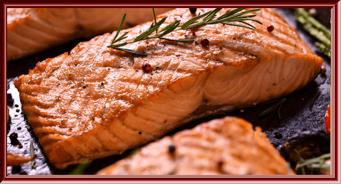 Salmon recipe served on a plate, by Angus Barn