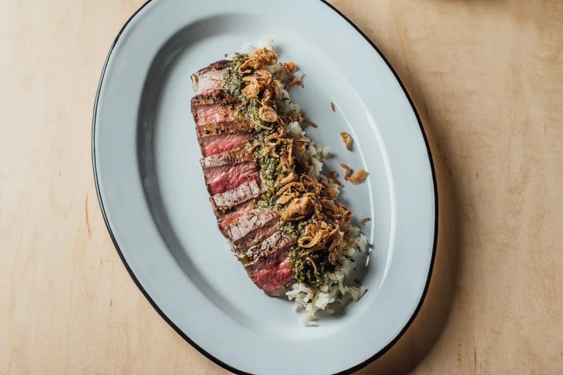 Chimichurri Steak recipe served on a plate, by Spoonbill Watering Hole & Restaurant