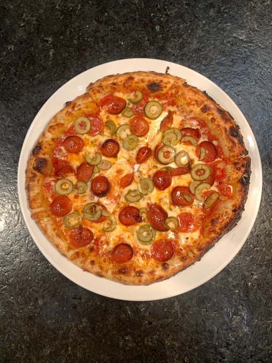 BBQ Chicken Pizza recipe served on a plate, by JT’s Urban Italian BBQ Chicken Pizza recipe served on a plate, by JT’s Urban Italian