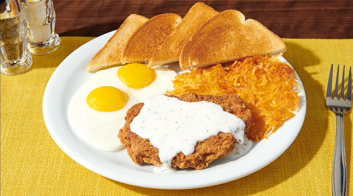 Country Fried Steak & Eggs recipe served on a plate, by Denny's Country Fried Steak & Eggs recipe served on a plate, by Denny's