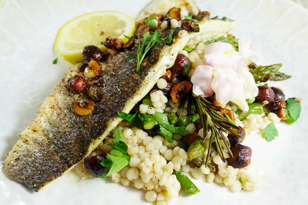 Branzino recipe served on a plate, by Tavernetta Branzino recipe served on a plate, by Tavernetta