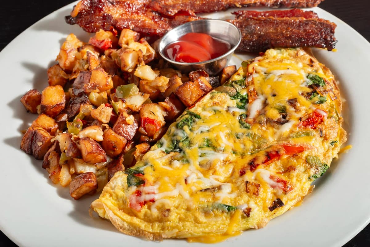 3 Egg Omelette recipe served on a plate, by Smokin Fins 3 Egg Omelette recipe served on a plate, by Smokin Fins