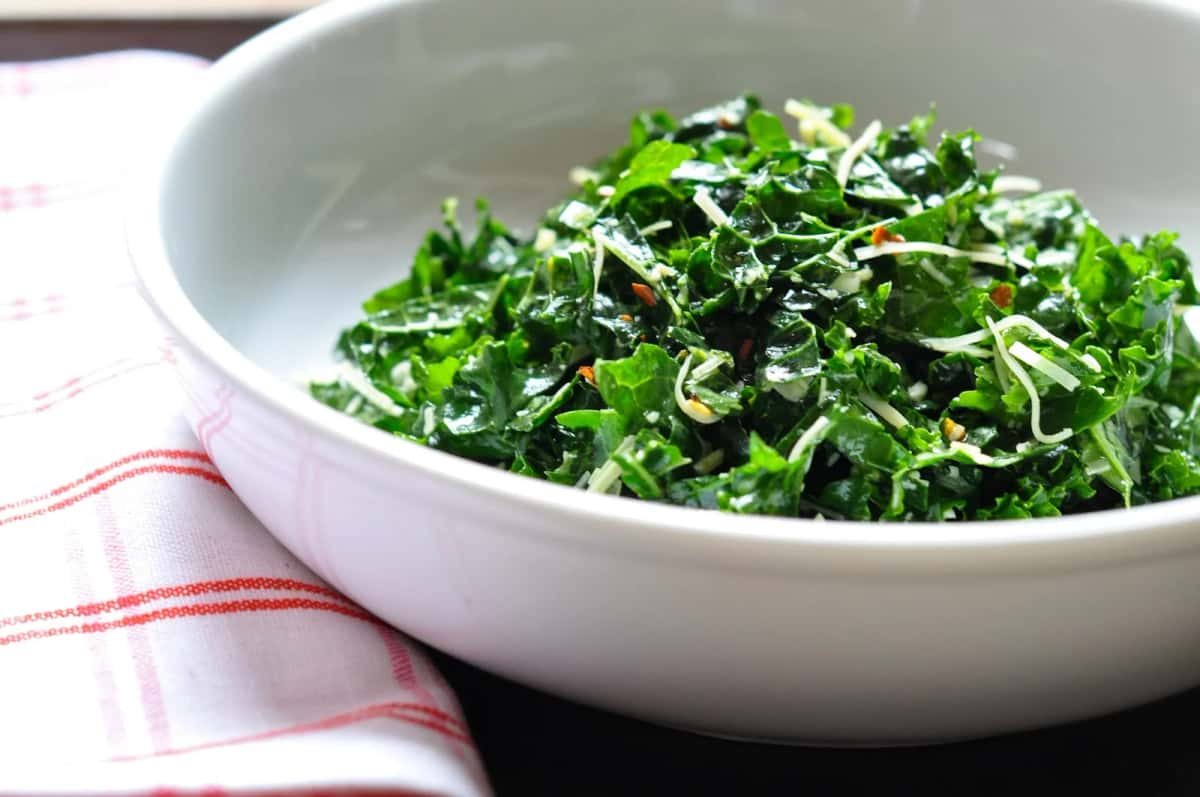 Kale Salad recipe served on a plate, by Cocha Kale Salad recipe served on a plate, by Cocha