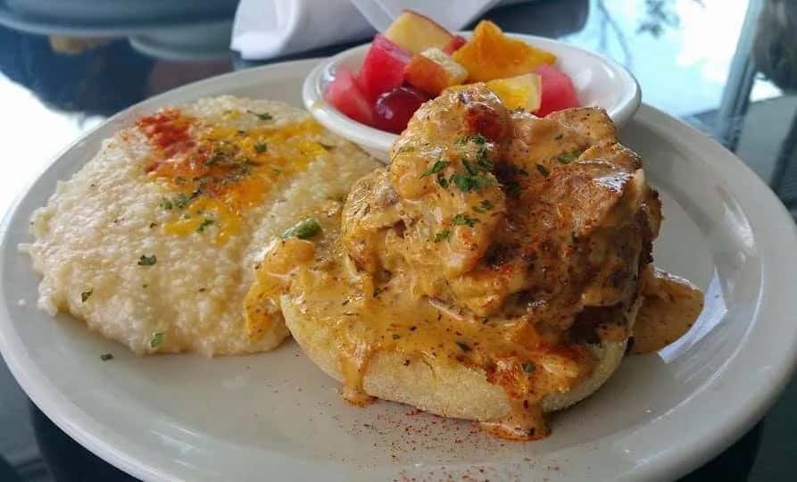 Eggs and Grits recipe served on a plate, by Cafe Rue Orleans - Cajun & Seafood Eggs and Grits recipe served on a plate, by Cafe Rue Orleans - Cajun & Seafood