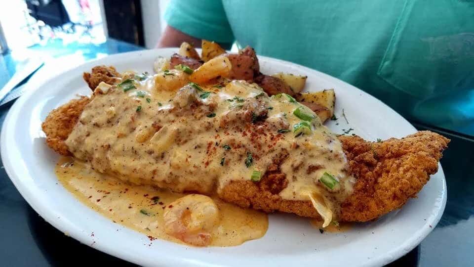 Catfish Tchoupitoulas recipe served on a plate, by Cafe Rue Orleans - Cajun & Seafood Catfish Tchoupitoulas recipe served on a plate, by Cafe Rue Orleans - Cajun & Seafood