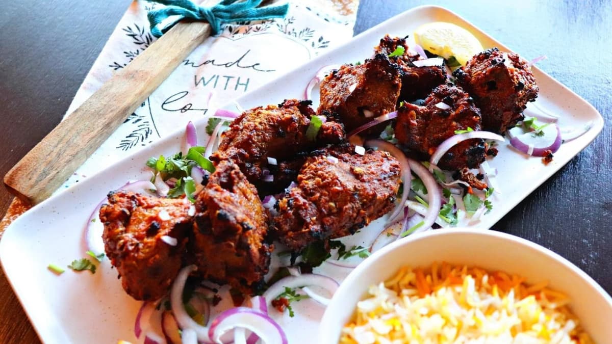 Lamb Boti Kebab recipe served on a plate, by Passage To India Restaurant Lamb Boti Kebab recipe served on a plate, by Passage To India Restaurant