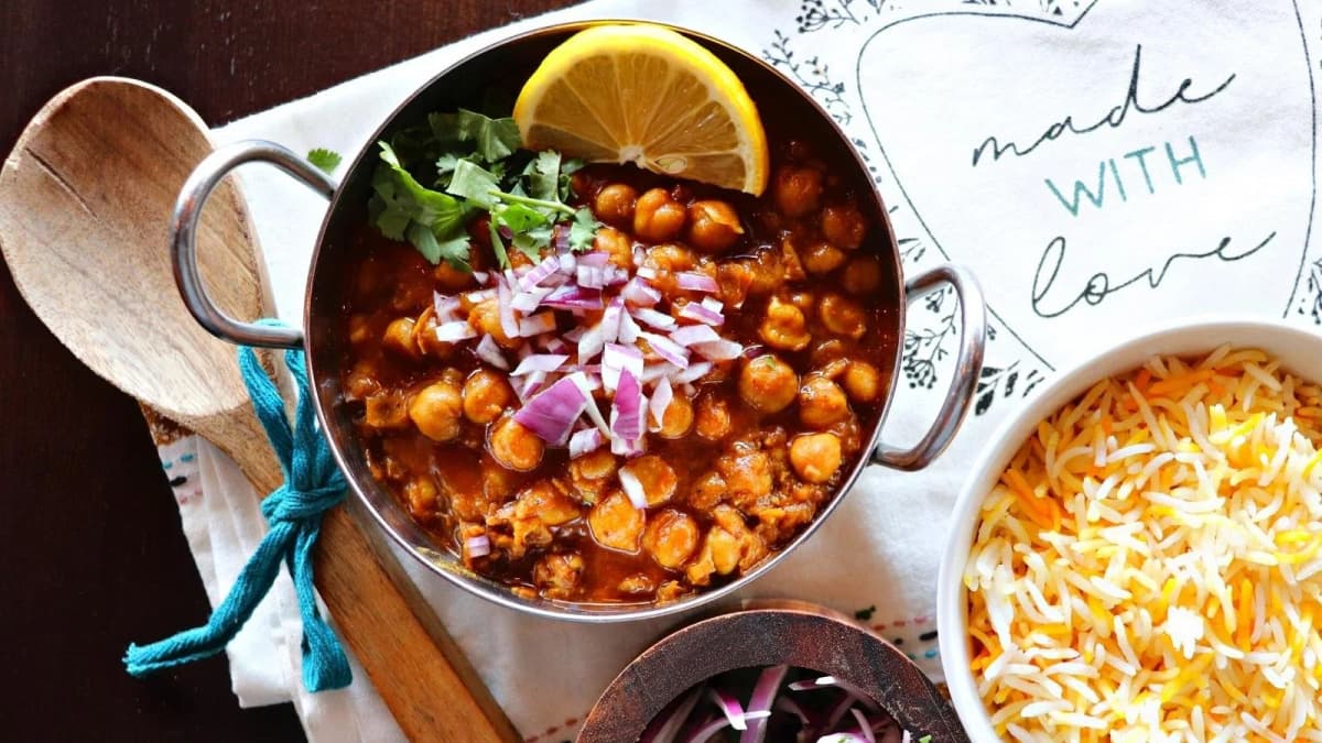 Chana Masala recipe served on a plate, by Passage To India Restaurant Chana Masala recipe served on a plate, by Passage To India Restaurant