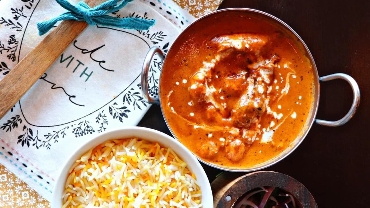 Butter Chicken recipe served on a plate, by Passage To India Restaurant Butter Chicken recipe served on a plate, by Passage To India Restaurant