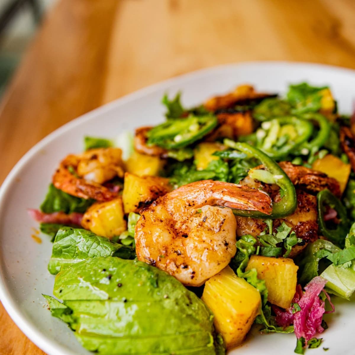 Pineapple Shrimp Tacos recipe served on a plate, by Fayetteville Taco & Tamale Co. Pineapple Shrimp Tacos recipe served on a plate, by Fayetteville Taco & Tamale Co.